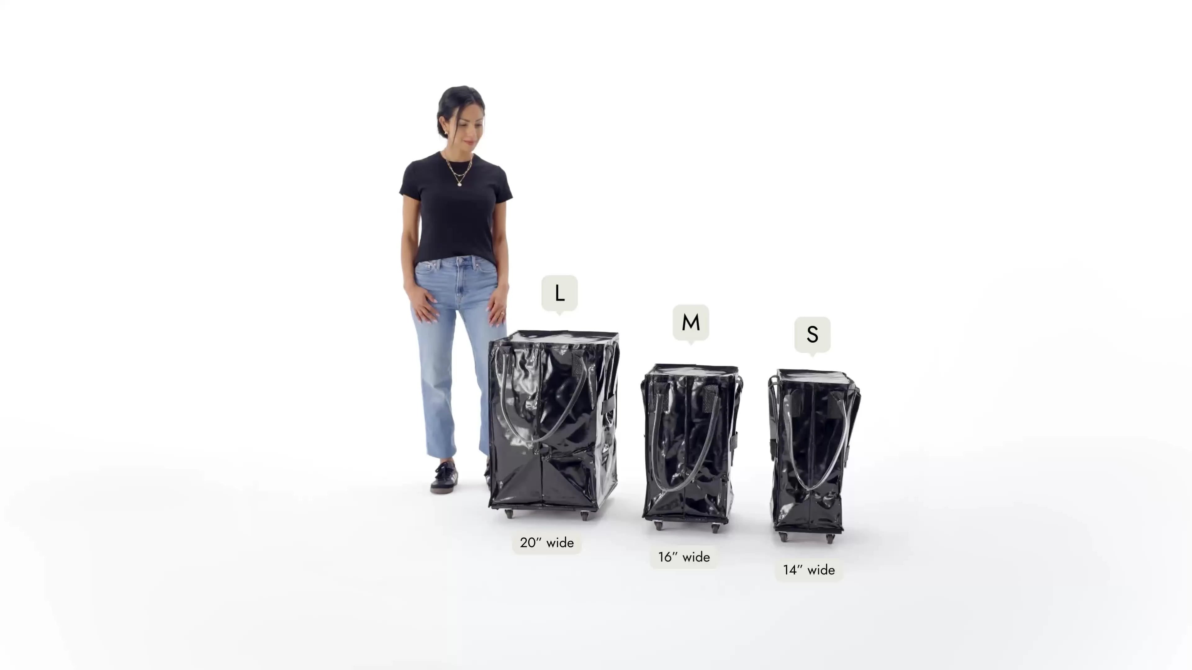 Woman standing next to three black trash cans labeled L, M, and S on a white background.