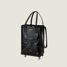 Black carry on tote on a light background