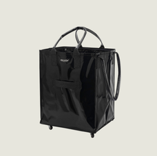 Black shopping tote bag with handles on a beige background